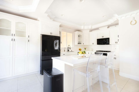 Bright open kitchen with large island and bar seating.