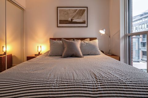 Queen-size bedding with nightstand lighting