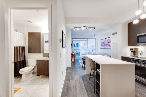 Bathroom & Kitchen to balcony from main entry