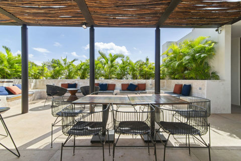 Enjoy lazy afternoons on our shared rooftop, where comfy seating areas and breathtaking views create the perfect environment for unwinding in style!  #ChillZone #TulumViews #RelaxAndEnjoy