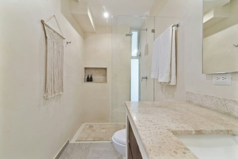 Indulge in a luxurious experience with our elegant master bathroom, featuring a rejuvenating rain shower that transforms your daily routine into a spa-like retreat!  #RainShower #LuxuryBathroom #TulumRetreat