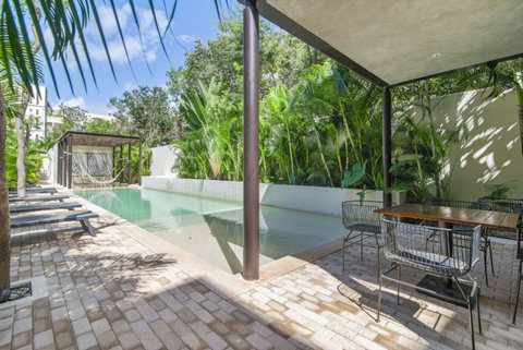 Soak up the sun by our beautiful swimming pool, designed for lounging, swimming, and creating unforgettable memories with friends and family! ☀️ #TulumPool #SummerVibes #FamilyFun