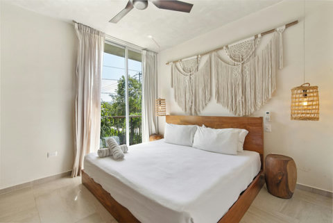 Retreat to the luxurious master bedroom featuring a spacious king-size bed, perfect for a restful night’s sleep after a day of exploring Tulum! ️ #LuxuryLiving #TulumRetreat #ComfortableStay