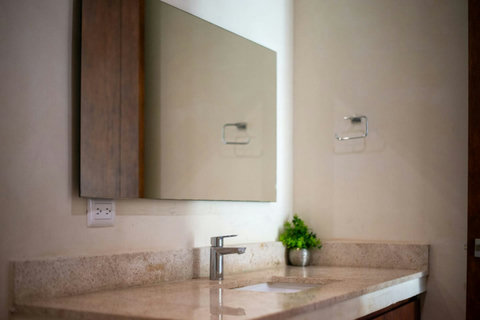Enjoy the privacy of a separate toilet in our beautifully designed second bathroom, offering convenience alongside elegant touches for your comfort!  #PrivateToilet #TulumRetreat #HomeAwayFromHome