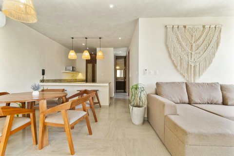 Step into our spacious living room, a blend of comfort and style, featuring a large smart TV for endless entertainment! ️ #TulumLivingRoom #VacationVibes