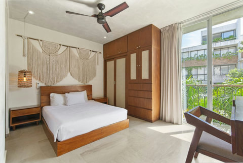 Relax in our cozy second bedroom, featuring a comfortable double bed and stylish decor for a restful night in Tulum!  #CozyRetreat #TulumGetaway