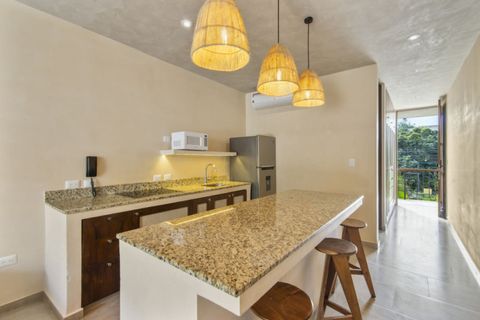 Modern kitchen, bar stools, and soft lighting — ideal for cooking or casual dining at home.