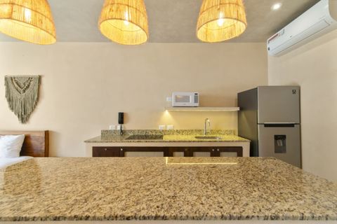 Enjoy home-cooked meals in this stylish kitchen with granite finishes, cozy lighting, and everything you need to feel at home.