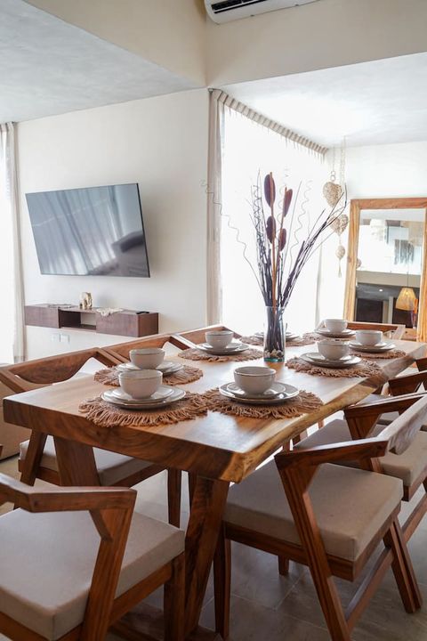 In the main living space, you will find a large dining area with a beautiful dining table which can seat 8 people for diner or more