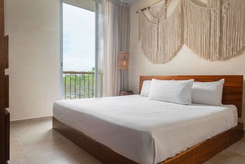 The master suite is equipped with a comfortable king size bed and plenty of storage space
