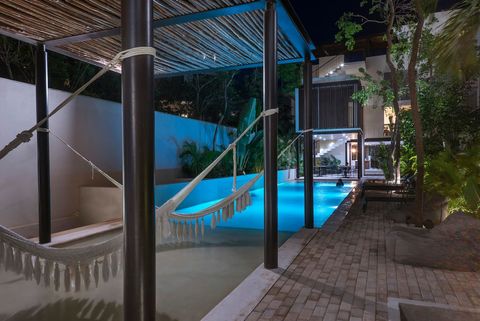 At the end of the swimming pool, there are a few hammocks which you can use. This space will be particularly cool to use at night for a relaxing moment
