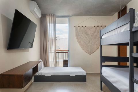 The second bedroom is furnished with three individual beds in total and also a Smart TV. This is the perfect room for kids