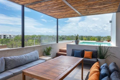 You'll definitely enjoy using this rooftop terrace and especially this outside dining space which is equipped with comfortable seating and plenty of extra pillows