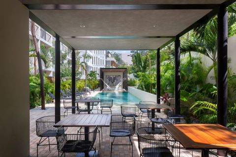 By the end of the swimming pool you will find a super cool outside dining area shared with other residents. You'll be able to use this space when you want during the hours of the day