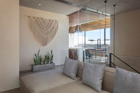 The lounging area is located directly next to the entrance of the rooftop area