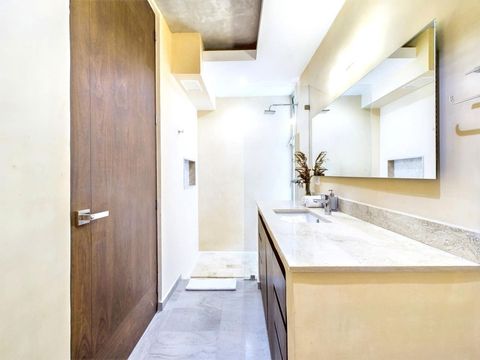 Indulge in luxury in the full bathroom, featuring a spacious shower and ample storage, stocked with all the essential toiletries for a comfortable stay.