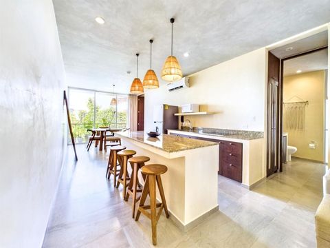 Cook with ease in the fully equipped kitchen, featuring modern appliances including a cooking stove and microwave for all your culinary adventures.