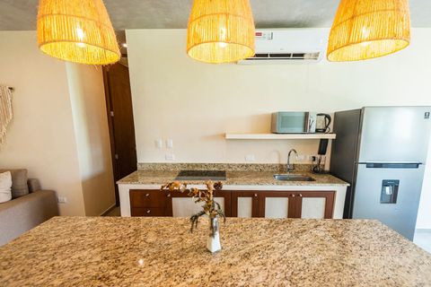 The kitchen has a large counter top with a few bar stools so you can use this space to hang out with friends