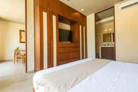 The bedroom is furnished with a comfortable king size bed and it has direct access to ensuite bathroom