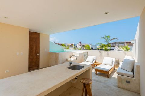 On the rooftop you will find multiple sundecks and also a bar and outside kitchen area