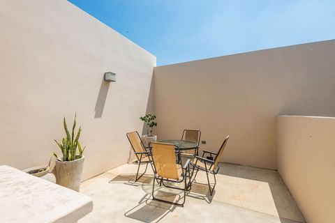 On the other side of the rooftop terrace you will find a table with a few chairs where you can hang out
