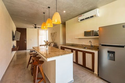 The kitchen is totally opened and fully equipped with all the appliances and amenities you may need to cook at home