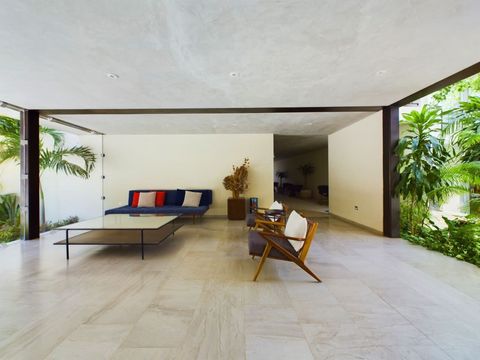 After you enter the condo you will arrive here in this reception space with a few sofas where you can hang out