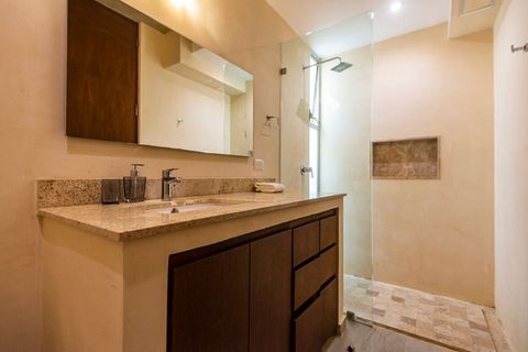 The bedroom is a full bathroom with a large rain shower and plenty of storage space to keep your bathroom items organized during your stay