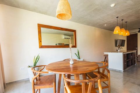 The living space is totally opened on the kitchen and the dining area, with plenty of natural light