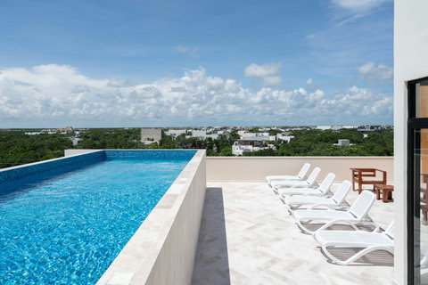 Relax at Giada Towers' expansive rooftop pool! Swim, sunbathe, and enjoy stunning views with plenty of deck space.