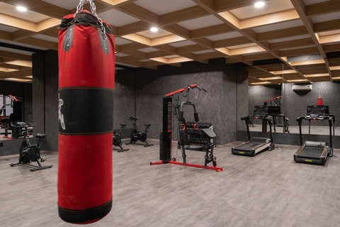 Keep up your fitness in our fully-equipped gym, featuring a variety of weights, cardio machines, and a boxing area—perfect for staying active and maintaining your workout routine while traveling.