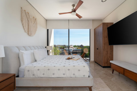 Escape to comfort in this king-size suite, complete with generous storage, a large TV, and a charming balcony—ideal for relaxing, enjoying views, and spending quality time with friends.