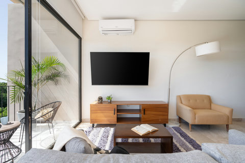 Enjoy your favorite moments in front of a large Smart TV that elevates the living area’s modern look—perfect for movie nights or simply relaxing in the comfort of a bright, elegant space.