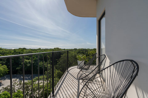 Start your day with coffee or unwind with evening drinks on your spacious private balcony—perfect for relaxing, soaking in the views, and enjoying peaceful outdoor moments.