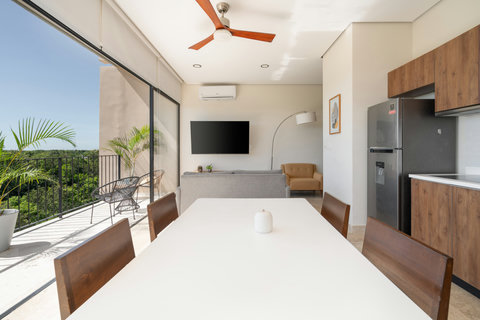 Share special moments in this elegant dining area featuring an open kitchen design, sleek wooden furniture, and natural light—perfect for cooking, connecting, and creating unforgettable memories.