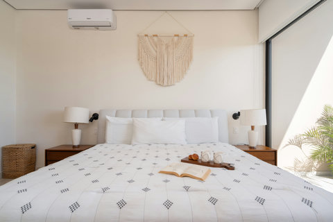 Movie nights made easy! Relax in our king-size suite complete with a large TV, cozy bed, and a private balcony for quiet moments