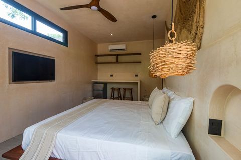 Cozy  bedroom with a sleek wall-mounted TV,  king size bed , rustic woven pendant light, and minimalist decor. The open shelving and bar area add a stylish, functional touch.