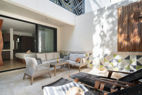 Enjoy the private patio with well-appointed outdoor furniture and chairs. Perfect for relaxing, reading, or spending quality time outdoors in a peaceful and comfortable setting.