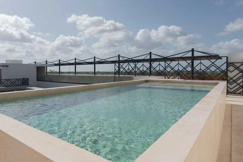 Indulge in the serenity of our exquisite pool on the terrace. A perfect space to enjoy and relax under the open sky, surrounded by beauty.