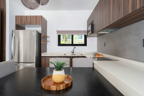 A stylish living space with a large dining table and plenty of space for our guests. The dining table can sit 6 people comfortably, with modern touches and high quality finishes.