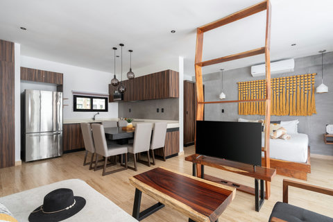 The living area is furnished with stylish furniture and a comfortable sofa and several chairs for hanging out and relaxing. You'll also find a large Smart TV with Netflix and Amazon Prime pre-installed for awesome movie nights.