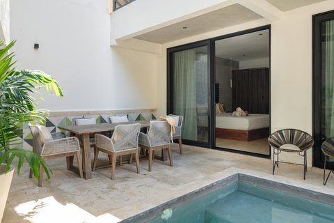 Enjoy a private patio with a plunge pool and outdoor dining area. Ideal for relaxing, soaking up the sun, or enjoying meals in a calm, exclusive setting designed for comfort.