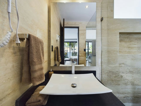 Step into luxurious bathrooms adorned with refined, elegant touches. Experience sophistication and grace in these beautiful spaces designed for ultimate comfort and allure.