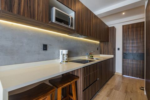 Indulge in the beauty of our kitchen, where modern amenities meet a warm decor, creating a welcoming and fully equipped culinary space.