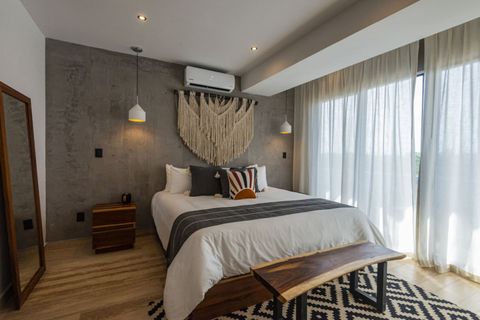 The master bedroom is a dreamy escape with a spacious bed, inviting you to unwind in comfort and style.