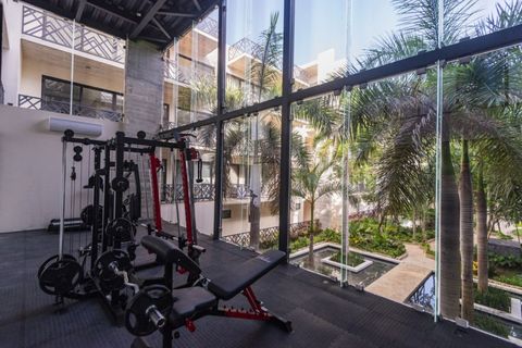 Discover our comprehensive gym space, thoughtfully furnished to support diverse workouts, fostering a complete approach to your fitness goals.