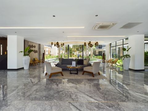 Step into the lobby, a welcoming reception area adorned with various seating options, exuding a warm ambiance to graciously welcome our guests upon their arrival.