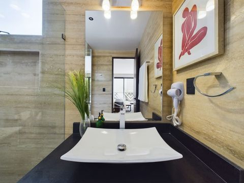 Discover exquisite bathrooms boasting sophisticated, elegant finishes. Embrace luxury and charm in these beautifully designed spaces, perfect for unwinding in style.