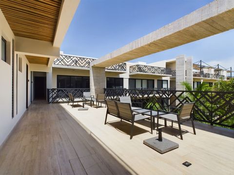Explore Palais Tulum's enchanting terrace, a haven adorned with cozy chairs, perfect for unwinding and basking in sunny moments.