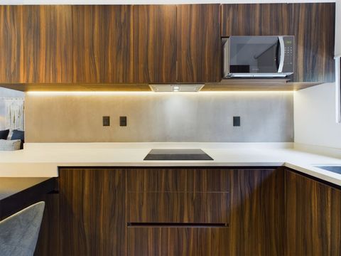 Discover a beautiful, modern kitchen boasting a minimalist design—perfect for crafting culinary delights in style and convenience.